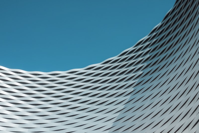 A modern building with striking curved geometric architecture